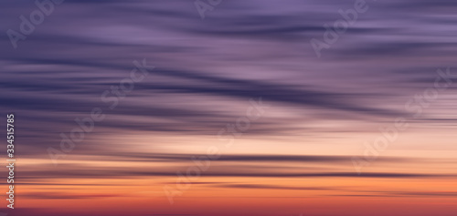 Wide beautiful blurred sunset orange, blue, purple gradient background