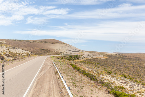 Asphalt road in the desert.  Road 3 (Ruta 3) through the Argentinean pampa - Santa Cruz province photo