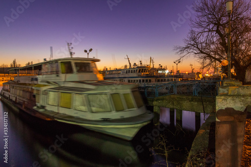 Old ship at sunset in the port of Kherson