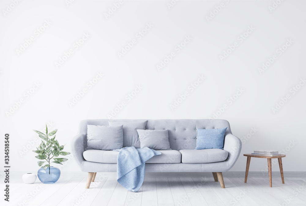 Bright room interior mockup for grey and light blue couch, beside wooden coffee table with books on it. Blue glass vase with green plant on the other side. White bright wall. Empty space concept. Bright room interior mockup for grey and light blue couch, beside wooden coffee table with books on it. Blue glass vase with green plant on the other side. White bright wall. Empty space concept.