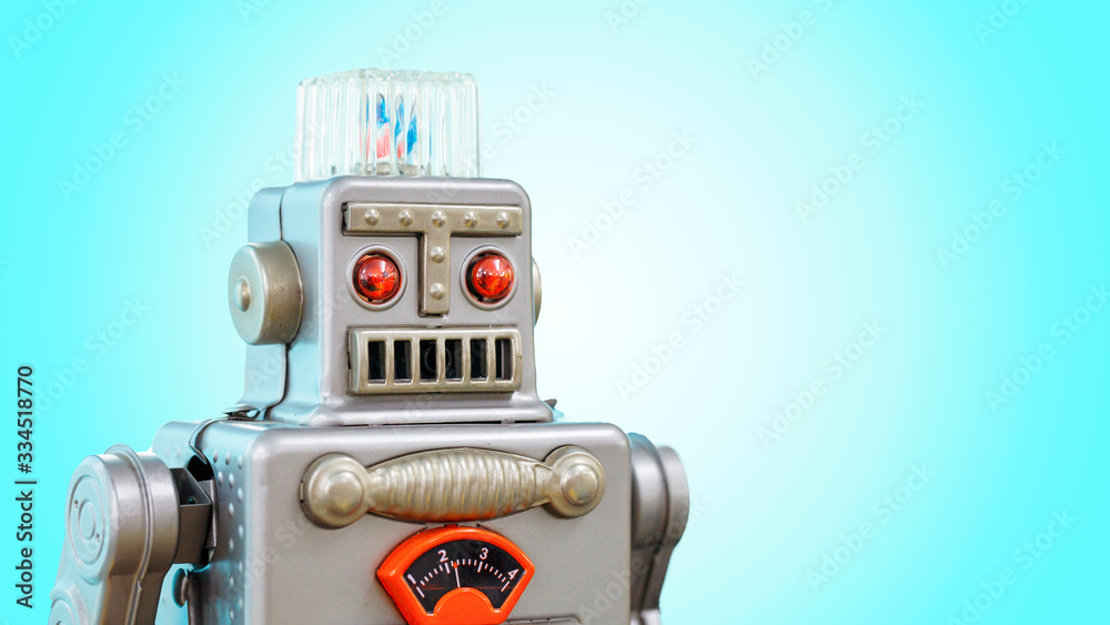 Fototapeta premium Retro robot tin toy isolated on blue background