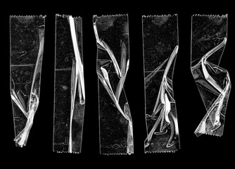 set of transparent adhesive tape or strips isolated on black background, crumpled plastic sticky snips, poster design overlays or elements.