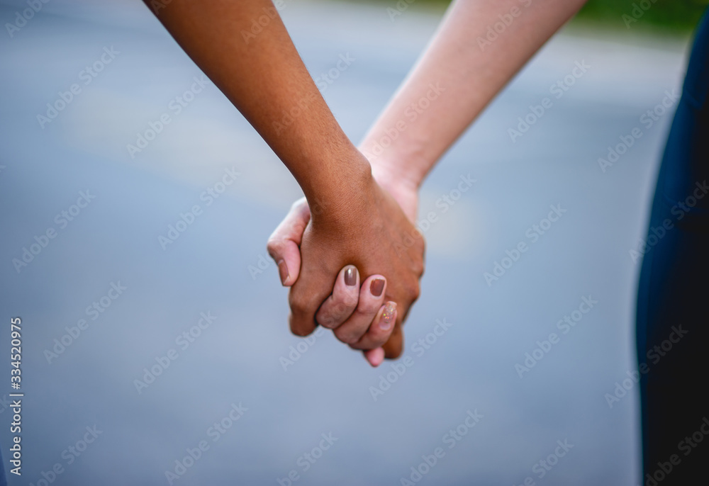 Holding hands with each other is an expression of love. Love concept Holding hands with each other is an expression of love. Love concept