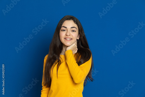 Brunette young girl wearing yellow jersey