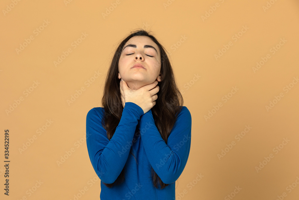 Brunette young girl wearing blue jersey