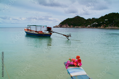 boats with floral ribbons in Chalok baan kao bay in Koh Tao island, Chumphon Archipelago, Thailand photo