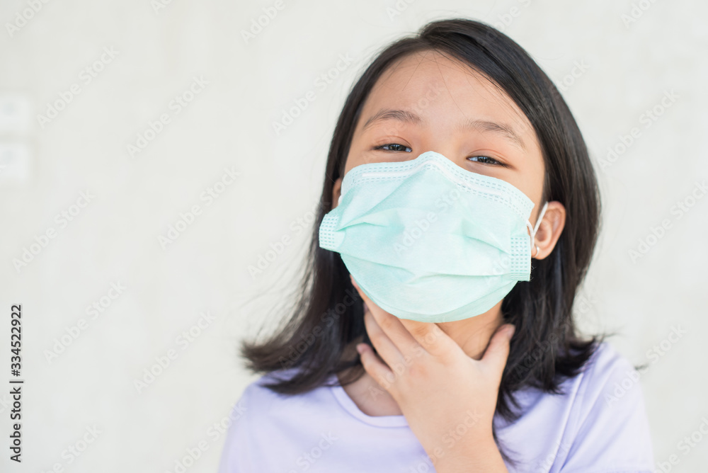 asia women wearing hygienic mask to prevent the virus PM2.5, Coronavirus, (2019-nCoV) asian little girl feeling unwell and coughing as symptom for cold or pneumonia,bronchitis. healthcare concept. asia women wearing hygienic mask to prevent the virus PM2.5, Coronavirus, (2019-nCoV) asian little girl feeling unwell and coughing as symptom for cold or pneumonia,bronchitis. healthcare concept.