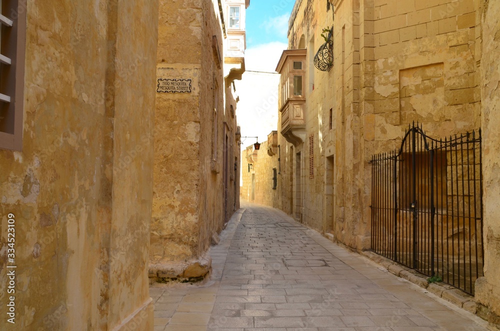 Beautiful view of ancient narrow medieval street town Mdina, Malta