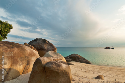 beach, rock and transparent sea at Teluk Keke beach at Besar Perhentian Islands, Malaysia