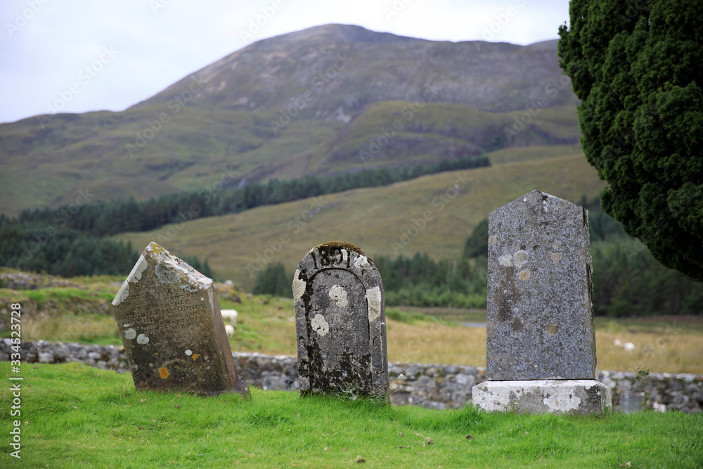 Cill Chriosd - Skye Island (Scotland), UK - August 13, 2018: Gravestones in the graveyard of Cill Chriosd / Kilchrist Church on the Isle of Skye, Inner Hebrides, Scotland, United Kingdom