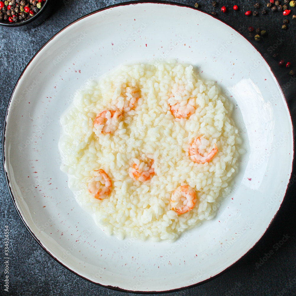risotto shrimp prawn seafood rice Menu concept. food background. top view copy space for text keto or paleo diets risotto shrimp prawn seafood rice Menu concept. food background. top view copy space for text keto or paleo diets