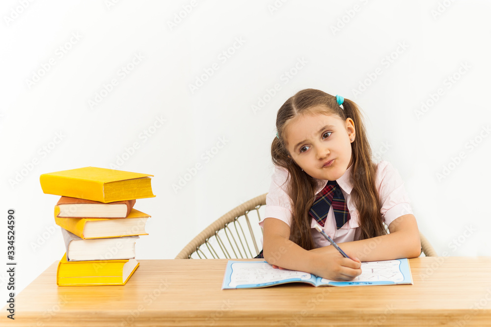 education and school concept - smiling little student girl with many books at school education and school concept - smiling little student girl with many books at school