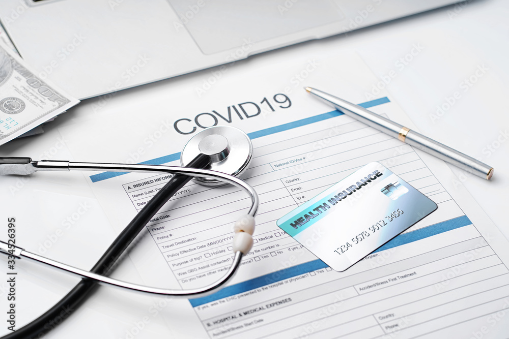 Coronavirus or COVID19 insurance policy document and Stethoscope on desk, Health Care Insurance Plan concept. Coronavirus or COVID19 insurance policy document and Stethoscope on desk, Health Care Insurance Plan concept.