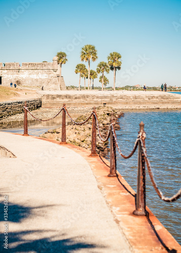  Sea Wall Walkway with Spanish Fort and Palm Trees in Background
