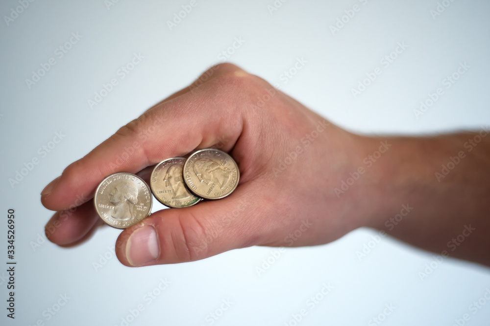 Three dollar coin in man hand. Last money. Concept photo. Financial crisis because of pandemic coronavirus. Man hands holding last metal coin Three dollar coin in man hand. Last money. Concept photo. Financial crisis because of pandemic coronavirus. Man hands holding last metal coin
