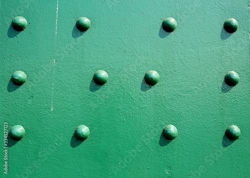 A beautiful old green bridge with steel structures.