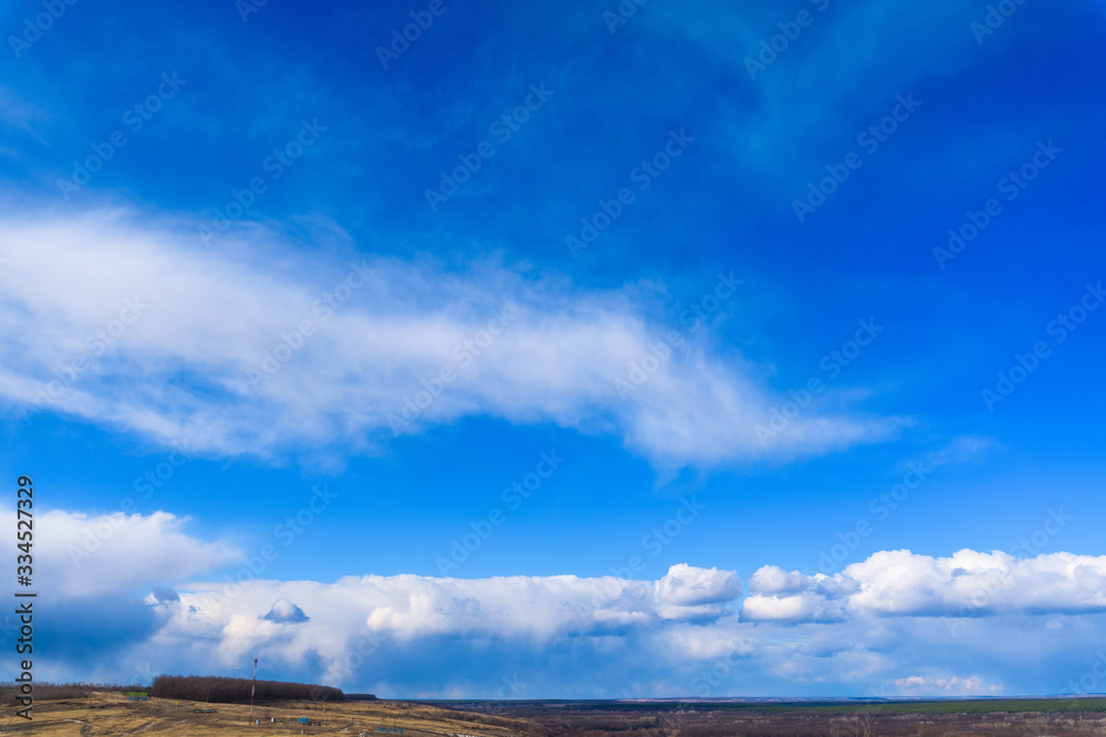 blue sky with white clouds on a clear Sunny day. photo for the banner. space for text