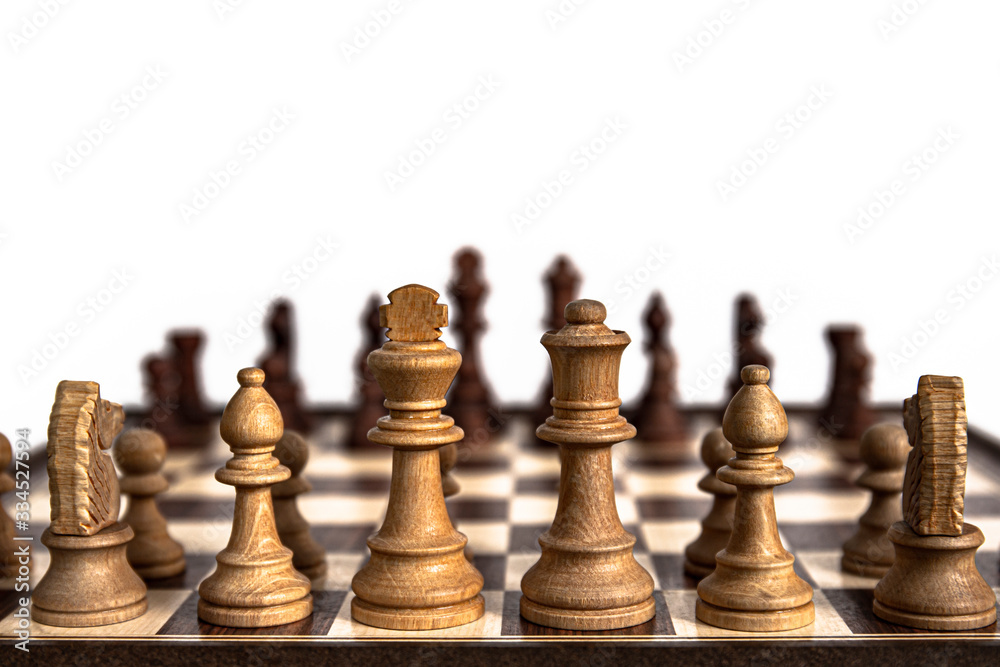 Chess pieces lined up on the chessboard. Concept picture concerning decision making and strategy. Chess pieces lined up on the chessboard. Concept picture concerning decision making and strategy.