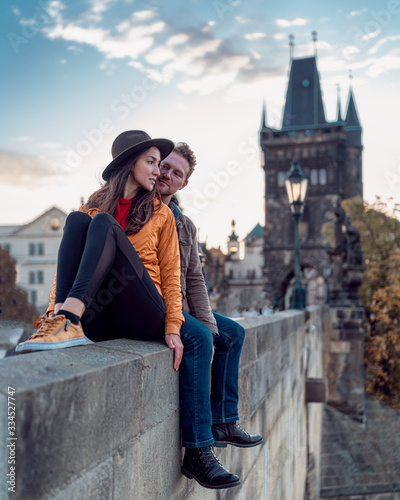 Fotobehang young couple on Charles bridge Prague czech republic Karluv most