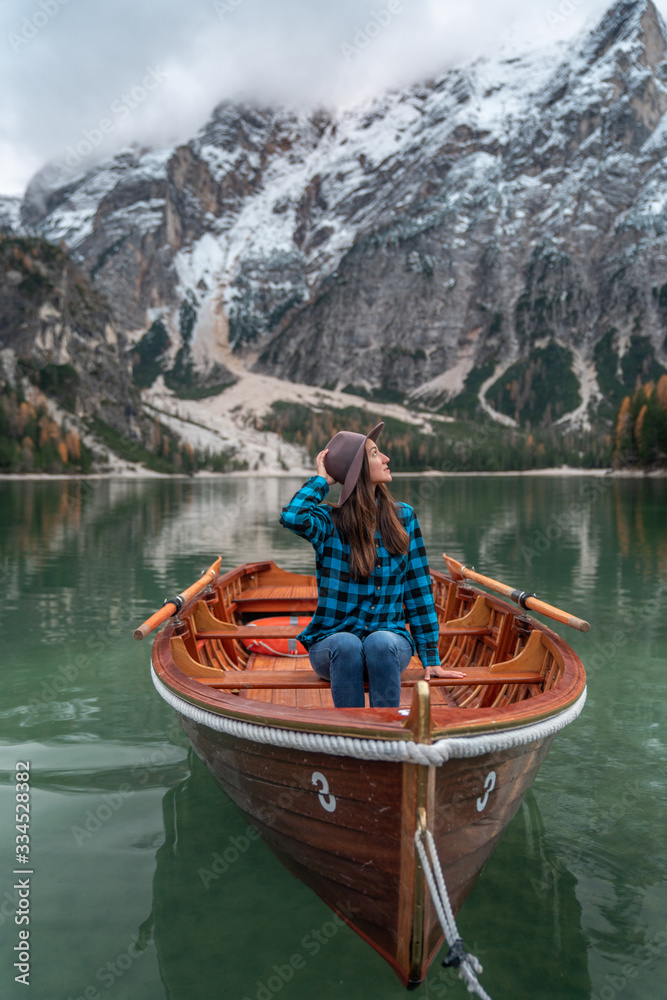 young girl on a boat Lago Di Braies Italy
