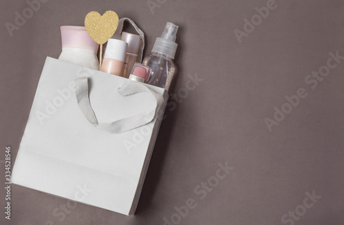 package with cosmetics as a gift to a woman