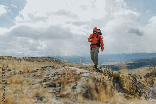  Man Traveler with Backpack hiking in the Mountains Activity scene. Wanderlust photo series