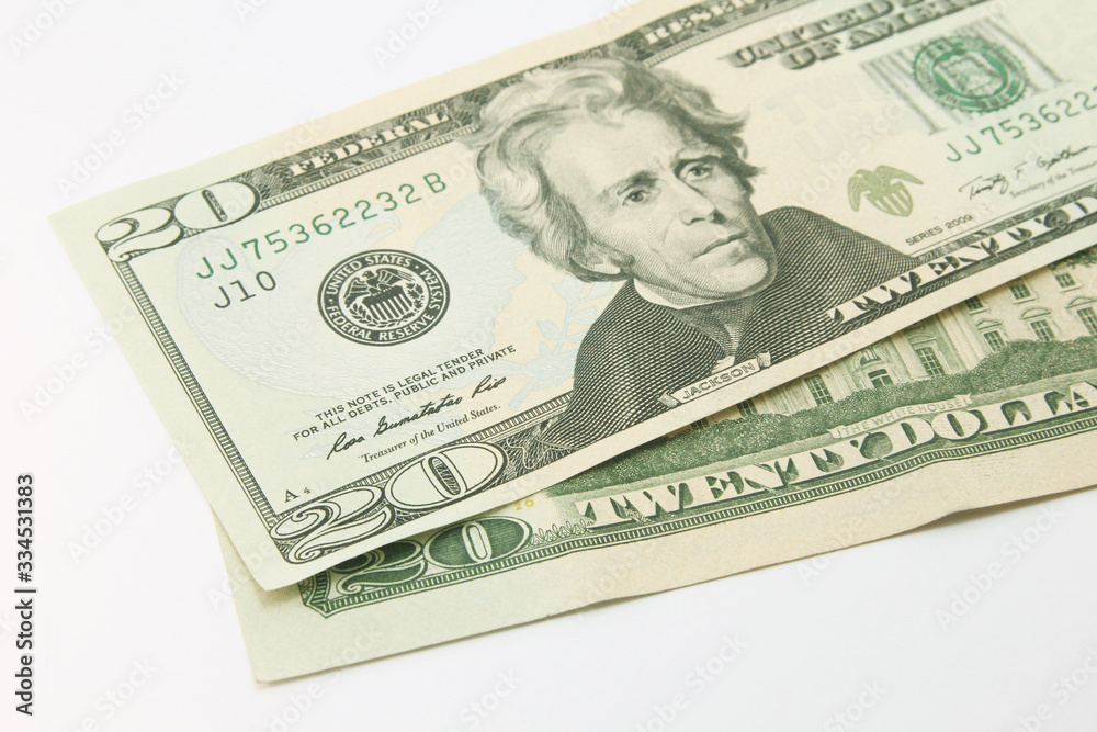 Twenty dollar bills in cash on white background Twenty dollar bills in cash on white background