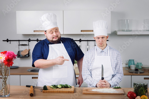 the chef takes an exam with an intern and laughs at him 