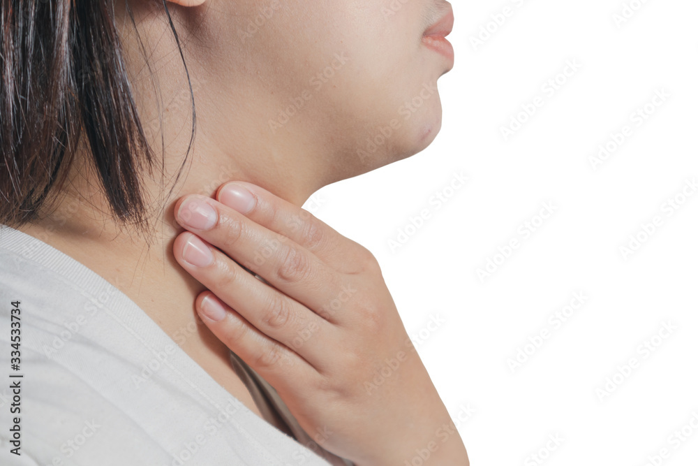 An Asian woman holding a hand in her neck shows a sore throat isolated on white background An Asian woman holding a hand in her neck shows a sore throat isolated on white background