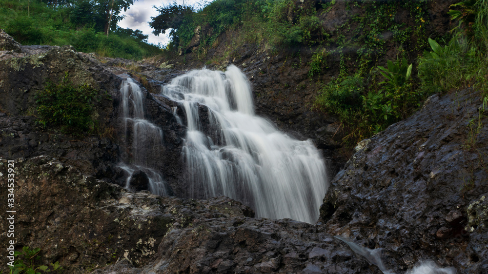 Cliffs with soft waterfalls in the hills Cliffs with soft waterfalls in the hills