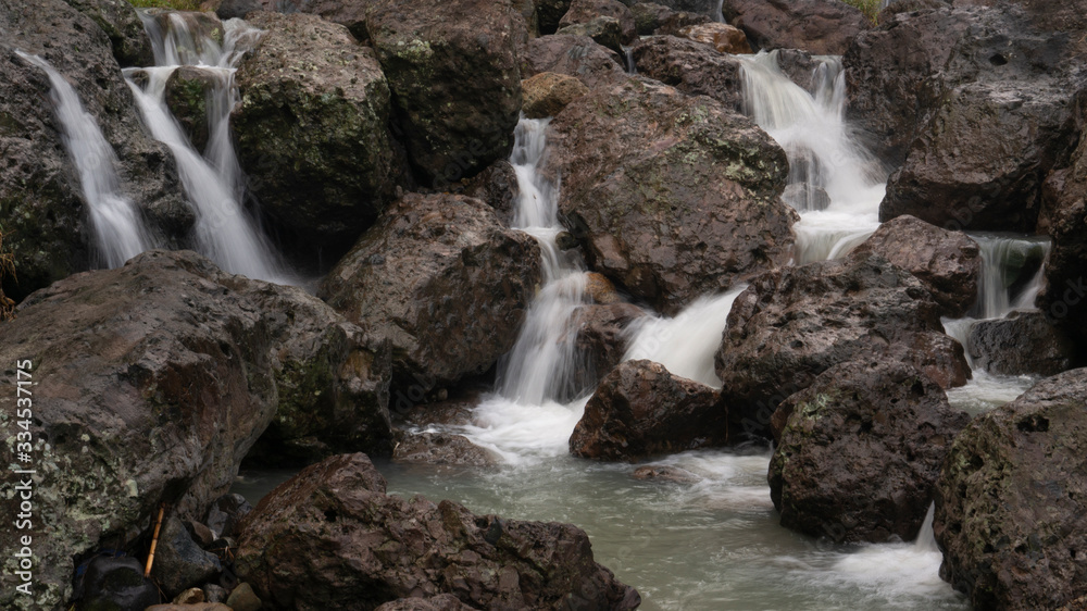 Cliffs with soft waterfalls in the hills Cliffs with soft waterfalls in the hills