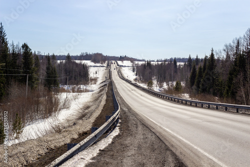 Tableau sur toile Asphalt road in the forest. A beautiful journey