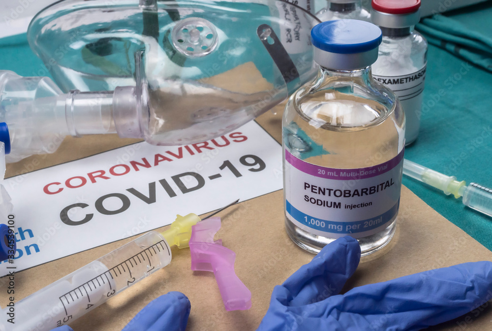 Vial of sodium pentobarbital next to an oxygen mask, covid-19 pandemic, Spain Vial of sodium pentobarbital next to an oxygen mask, covid-19 pandemic, Spain