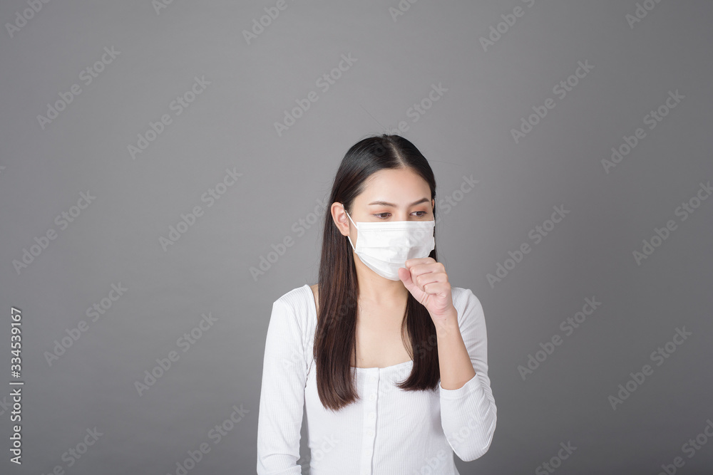 Portrait of woman with surgical mask in studio, Health care concept Portrait of woman with surgical mask in studio, Health care concept