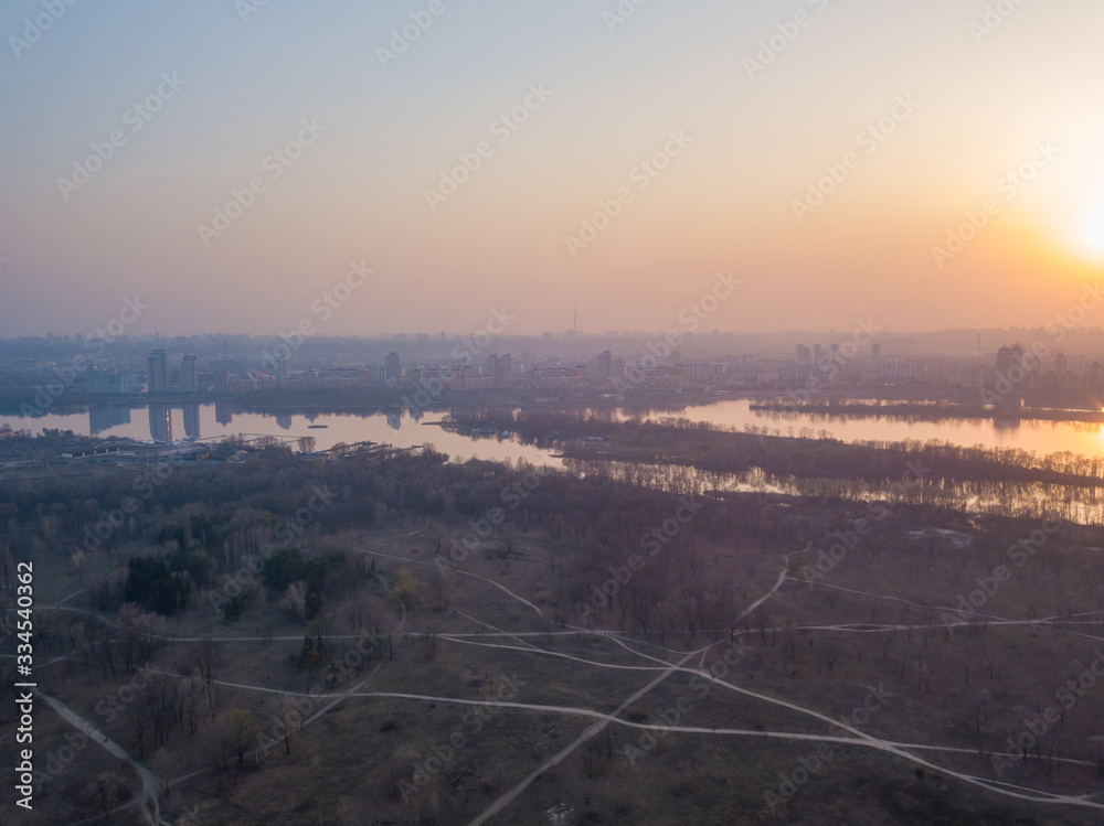 Sunset over the Dnieper River in Kiev. Aerial drone view.