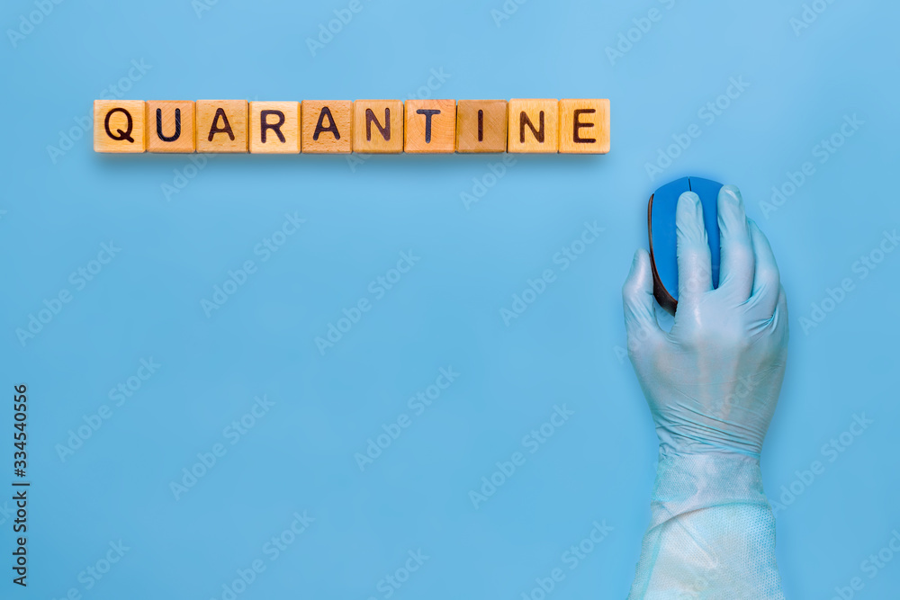 Fototapeta premium Person quarantined coronavirus in medical gloves. Self-quarantine, self-isolation concept. Coronavirus quarantine background. Stay at home concept. Hand in medical glove with computer mouse.