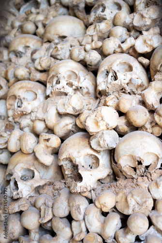 Pile of human sculls and bones in Bone Chapel (Capela dos Ossos) in Portugal, Algarve, Alcantarilha. photo