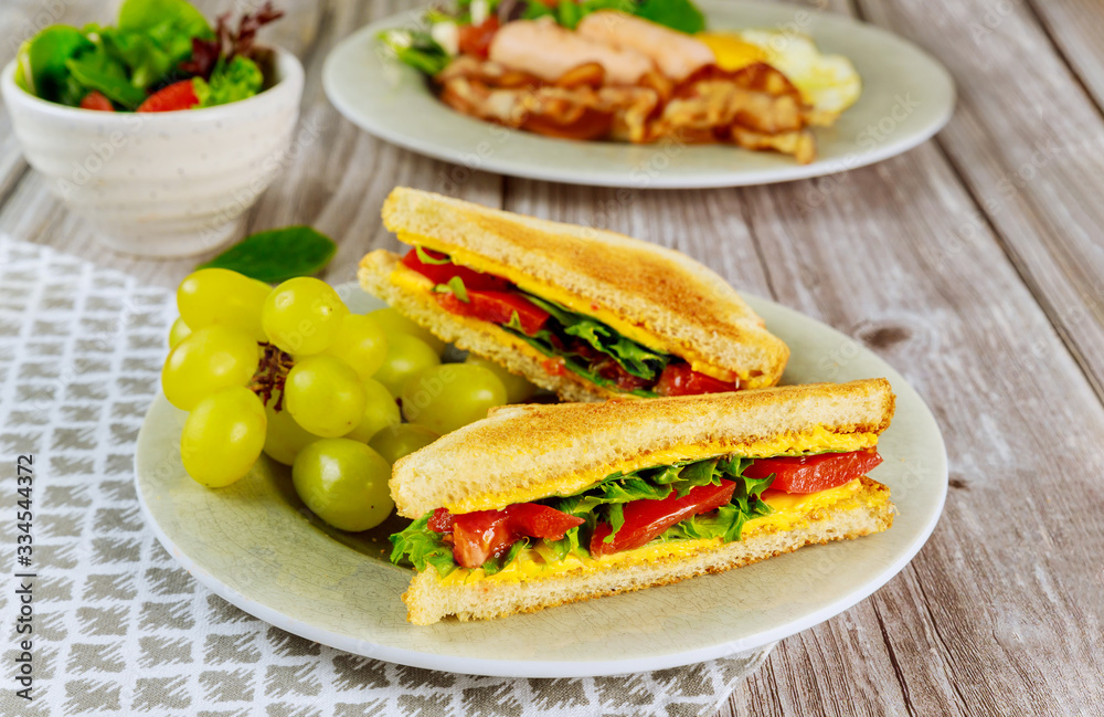 Toast with melted american cheese and grape for breakfast.