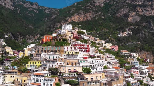 Beautiful aerial panorama view of Positano bay. Rocky shores and incredible beaches, Luxury yachts, boats and hotels, apartments overlooking Tyrrhenian Sea. Bright sunny day. Positano, Italy