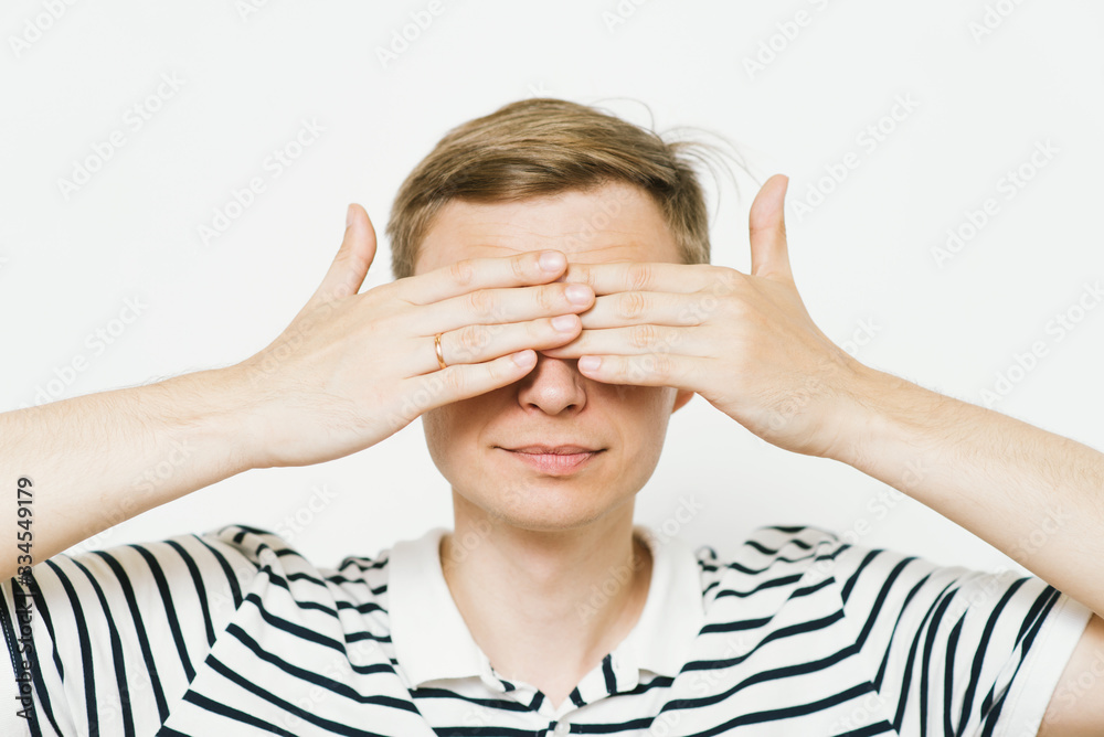 Man closes eyes with her hands Man closes eyes with her hands