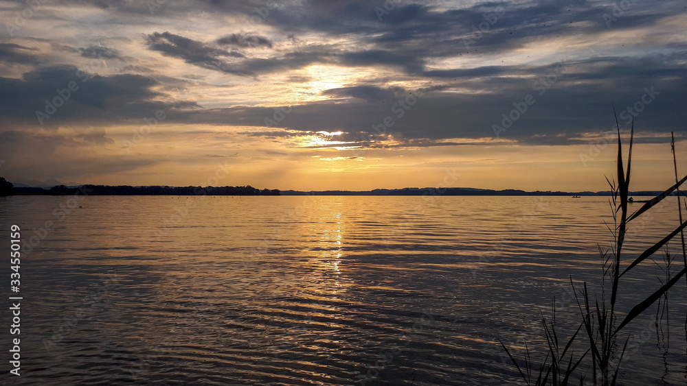 Tranquil sunset sky at lake Chiemsee, Bavaria, Germany Tranquil sunset sky at lake Chiemsee, Bavaria, Germany