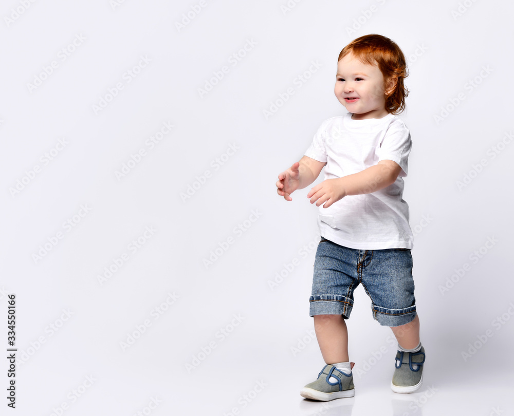 Happy little kid running - isolated over a white background Happy little kid running - isolated over a white background