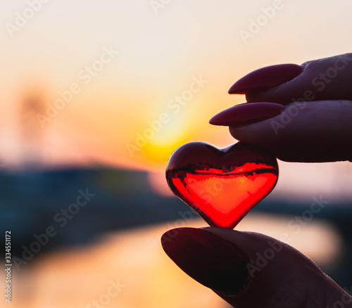  glass heart on sunset background