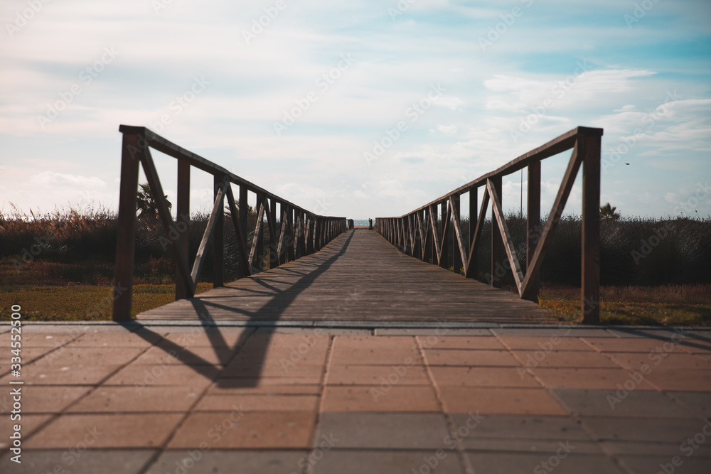 Perspective View of a Wooden Bridge Constructed on Brick Pavements