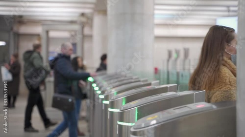 Coronavirus in Moscow, woman entering Moscow metro in medical face mask, COVID-19 Moscow life