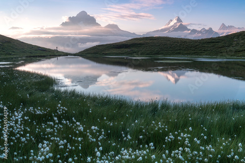 Fantastic morning panorama of Bachalp lake / Bachalpsee, Switzerland. Picturesque autumn sunset in Swiss alps, Grindelwald, Bernese Oberland, Europe. Beauty of nature concept background. Popular place photo