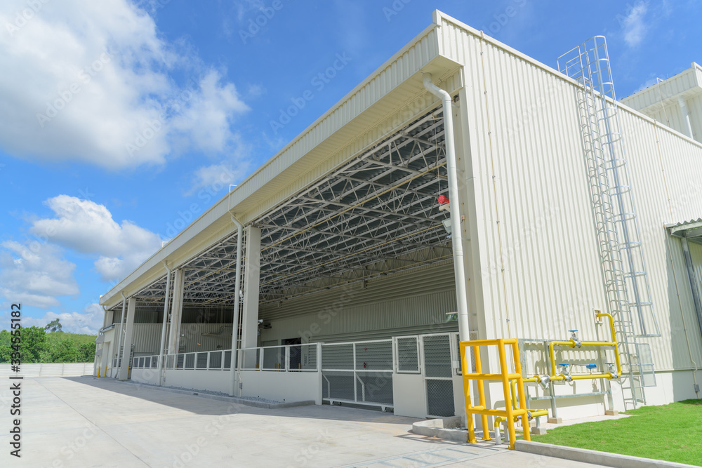 Newly industrial warehouse building with blue sky
