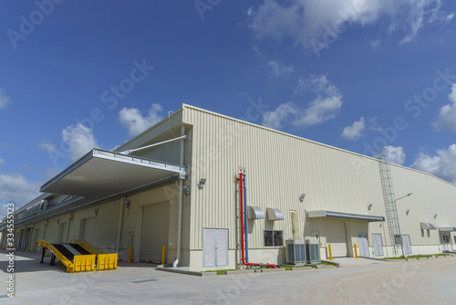 Newly industrial warehouse building with blue sky