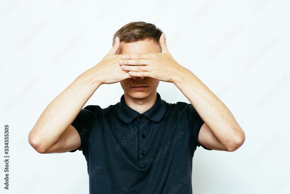 Man closes eyes with her hands Man closes eyes with her hands