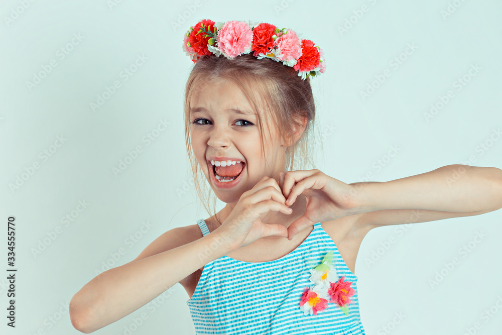 kid making heart sign with hands